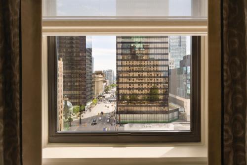 a window with a view of a city street at Fairmont Hotel Vancouver in Vancouver