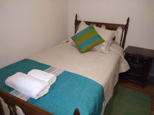 Ein Bett oder Betten in einem Zimmer der Unterkunft Hostal Casa Blanca