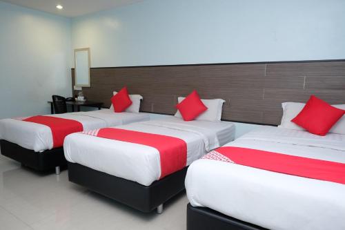Ένα ή περισσότερα κρεβάτια σε δωμάτιο στο Hotel De' Tees, Masai Utama