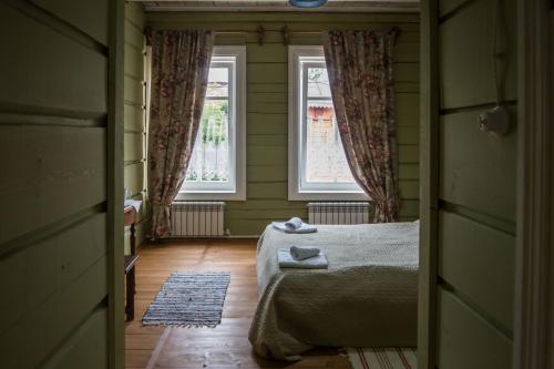 Ліжко або ліжка в номері Бутик-Отель "Доходный Дом Листратовой"