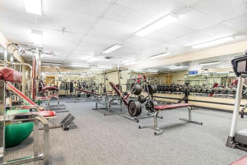 a gym with rows of equipment in a room at Quality Inn Shelburne - Burlington in Burlington