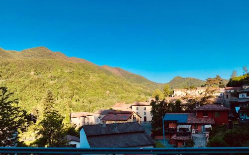 a group of houses in front of a mountain at B&B La Piazzetta in Castiglione dei Pepoli