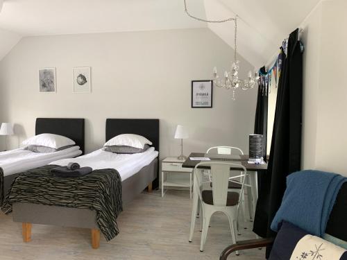 Postel nebo postele na pokoji v ubytování Green Door Apartments