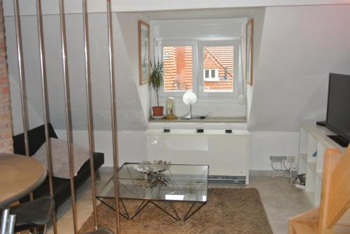 TV a/nebo společenská místnost v ubytování Appartement Studio Tournai
