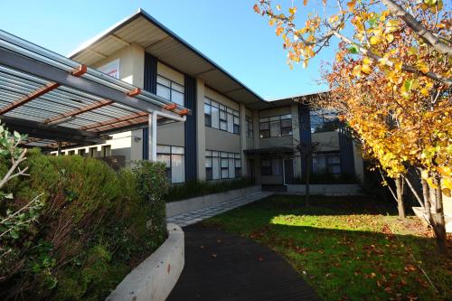 a building with a pathway in front of it at Glenelg Holiday Apartments-Ellis 200 meters to the Beach Free Parking in Adelaide