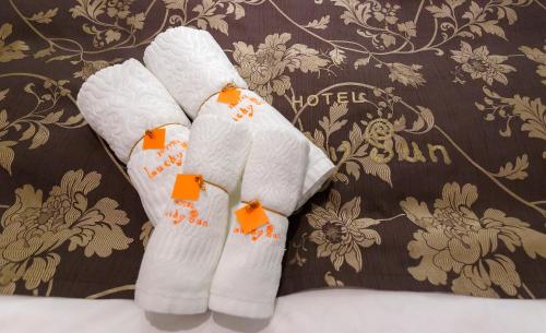 a pair of white socks with orange tags on them at Lucky Sun in Nishinomiya