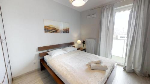 Una cama o camas en una habitación de Amsterdam nad Odra - Dmowskiego 17F Tectum Apartments