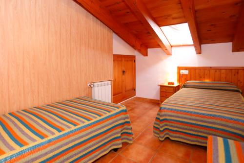 Posteľ alebo postele v izbe v ubytovaní Casa Enpiera III - Turistrat