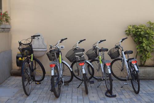 a group of bikes parked next to a wall at Residence Star in Turin