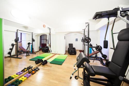 a gym with several treadmills and exercise equipment at Residence Star in Turin