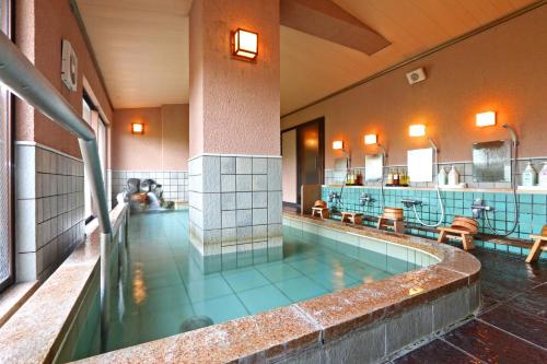 a large swimming pool in a building at Hounkan in Yoshino
