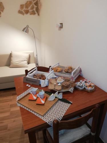 a table with two boxes of donuts on it at Historical Domus in Anagni