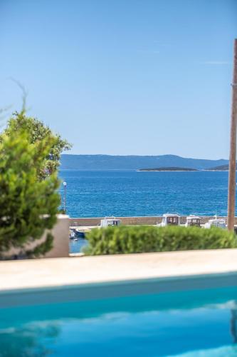 a view of the ocean from a swimming pool at Villa Gellia in Ugljan