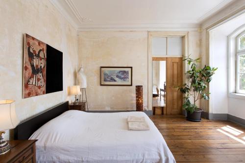 Uma cama ou camas num quarto em Lost Lisbon :: Cais House