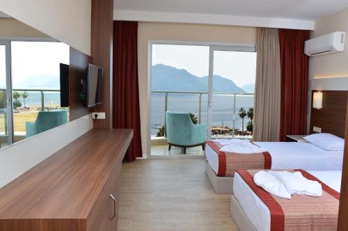 Postel nebo postele na pokoji v ubytování Sunway Club Otel