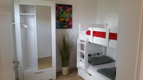 
Ein Etagenbett oder Etagenbetten in einem Zimmer der Unterkunft Ferienhaus am Fuchsberg
