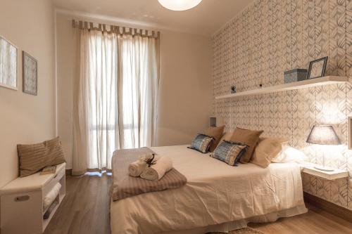 Cama o camas de una habitación en CASA GONZAGA con parcheggio