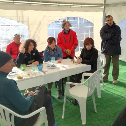 a group of people sitting around a table at Lago Secco Bed & Breakfast Country House in Accumoli