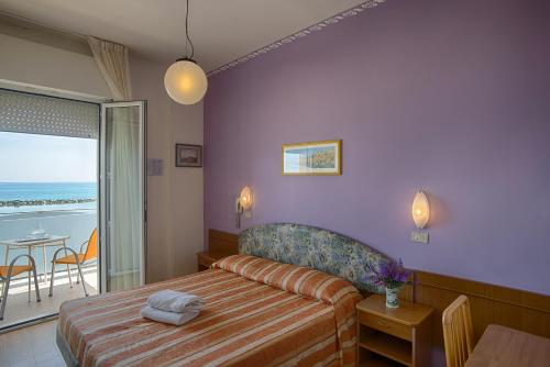 Postel nebo postele na pokoji v ubytování Hotel Meritime