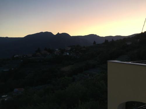 a view of the mountains at sunset from a building at Agriturismo LaValleggia in Tovo San Giacomo