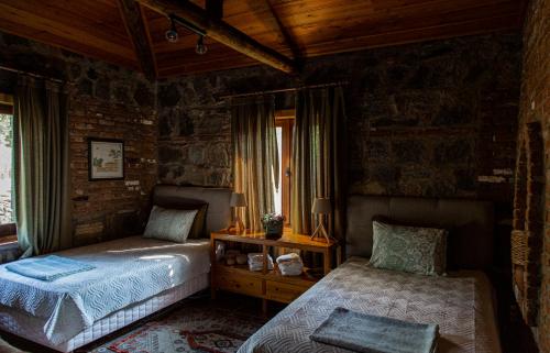 a bedroom with two beds and a window at Villa Demeter in Selçuk