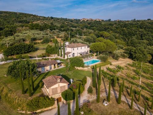 an aerial view of a house with a pool and trees at Countryhouse Villa Rey in Panicale