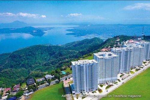an aerial view of a large building near the water at Wind Residence T4- M Near Taal view at Skylounge in Tagaytay