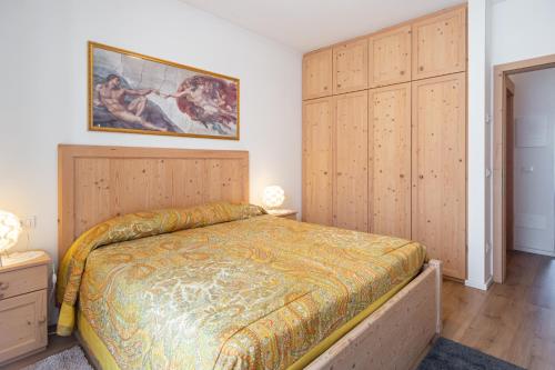 Postel nebo postele na pokoji v ubytování Holiday Apartments Val Moena