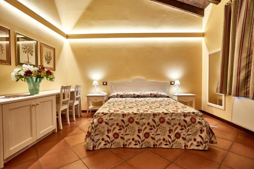 Postel nebo postele na pokoji v ubytování Albergo Trattoria Il Leone