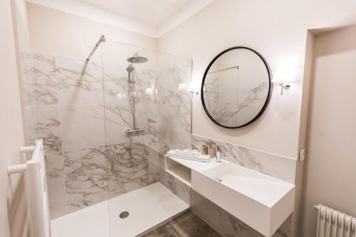 a bathroom with a sink and a mirror at Bastide de Ganay - Saint Jérôme in Aix-en-Provence