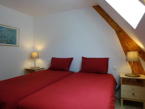 A bed or beds in a room at Le Pic de Pan - Auberge & Gîtes