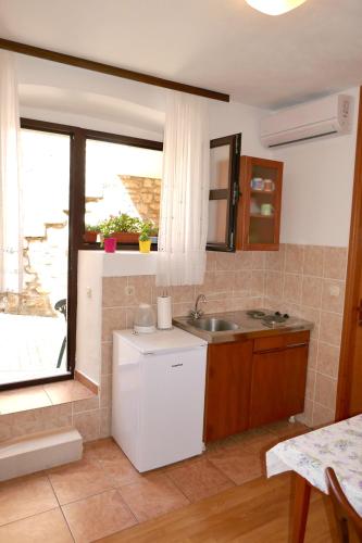 Ένα μπάνιο στο Apartments Ljubica