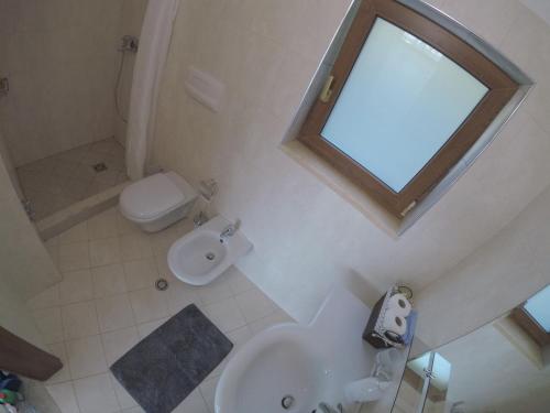 an overhead view of a bathroom with a toilet and sink at Seaview apartment in Borsh