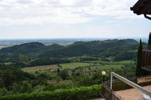 a view of a valley from the balcony of a house at B&b Ca'Baracca Bellavista in Bassano del Grappa