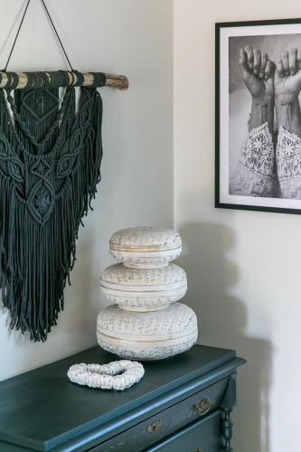 a stack of plates on top of a dresser at Viigi Villa in Haapsalu