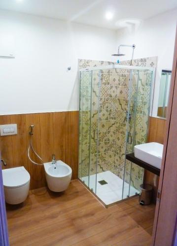 a bathroom with a glass shower and a sink at Alla Vecchia Contrada B&B in Provaglio Val Sabbia
