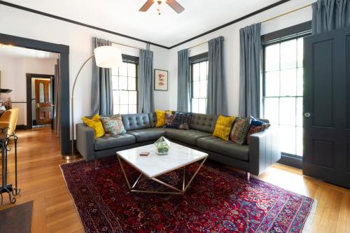 a living room with a couch and a coffee table at Addison Choate in Rockport