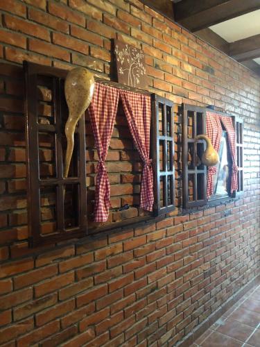 a brick wall with windows on a wall at Vila Zlatarka in Nova Varoš