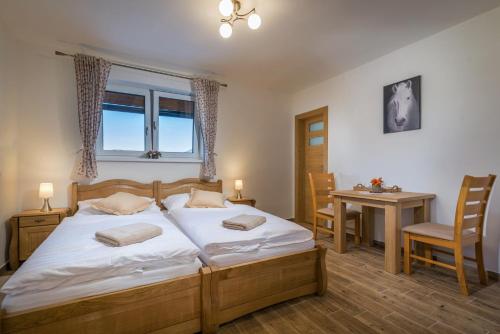 Posteľ alebo postele v izbe v ubytovaní Na Verande apartments Jasna