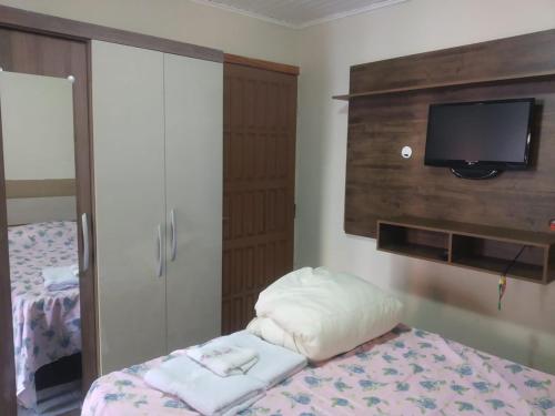 Ένα ή περισσότερα κρεβάτια σε δωμάτιο στο Pousada Vale das Águas