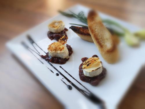 a white plate with some food on a table at Agroturystyka u Kozdryka in Leśna