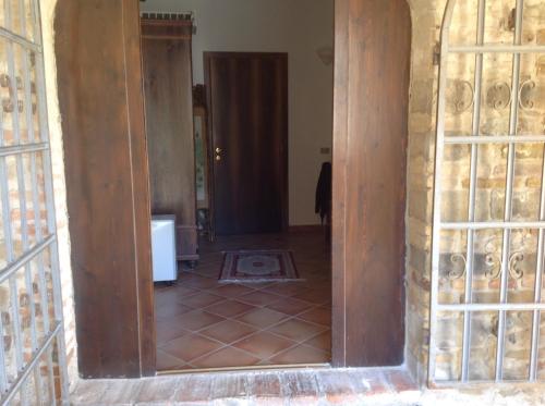 an open doorway into a room with a tile floor at Le Copertelle Bed & Breakfast in Serra San Quirico