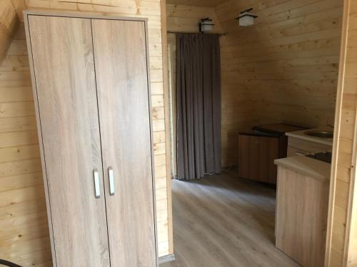 a room with a closet and a door in a room at Karpatskyy in Rozluch