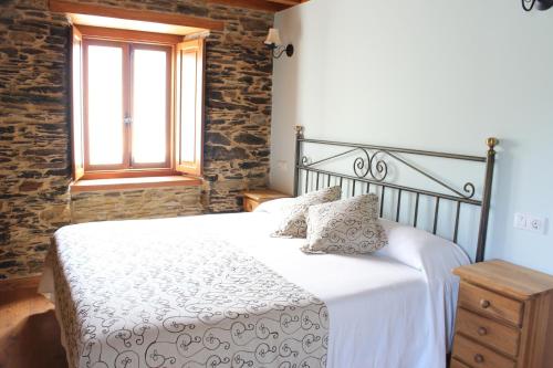 Postel nebo postele na pokoji v ubytování Casa Rural Soutomoro