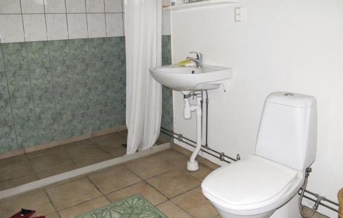 a bathroom with a toilet and a sink at Amazing Home In Forshaga With 2 Bedrooms in Forshaga