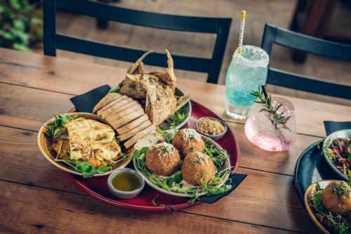 a plate of food on a wooden table at Mick O'Sheas in Hackham