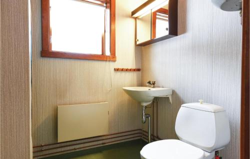 a bathroom with a toilet and a sink at Amazing Home In Sysslebäck With Kitchen in Sysslebäck
