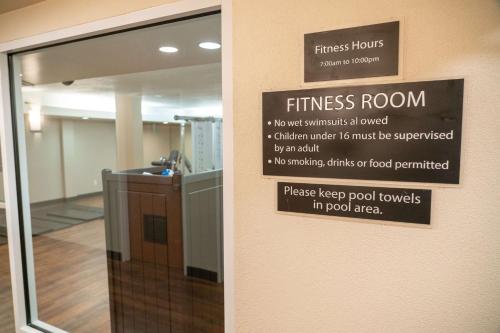 a sign on the wall of a fitness room at Pocaterra Inn & Waterslide in Canmore
