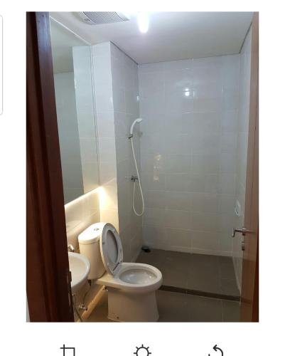 a bathroom with a toilet and a shower stall at 2 Bed Room Amazing Sea View Condo 80sqm Fast Internet in Jakarta