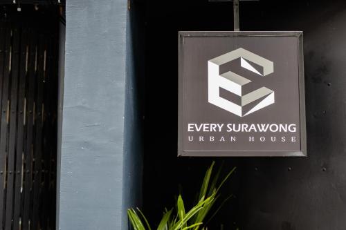 a sign on the side of a building at Every Surawong in Bangkok